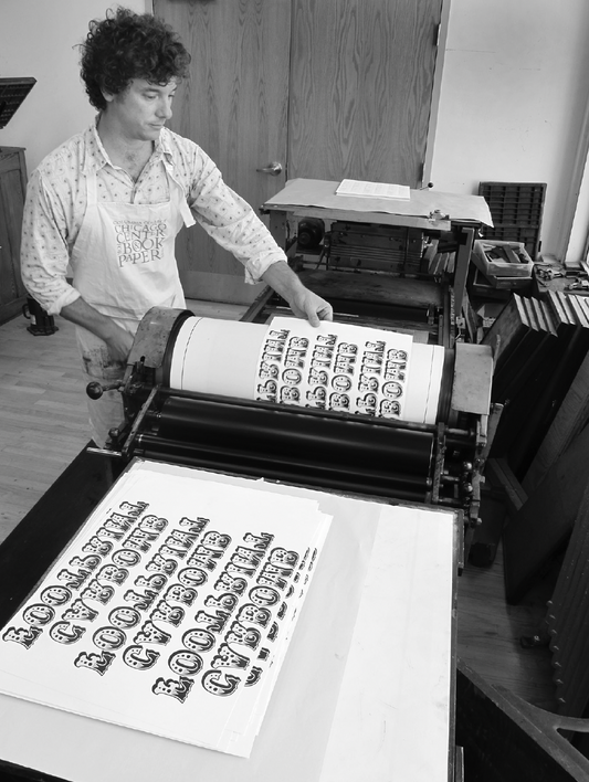 Kyle Schlesinger printing BUMPERS during his residency at the Center for Book and Paper Arts, Columbia College Chicago, 2011, photo by B Freeman